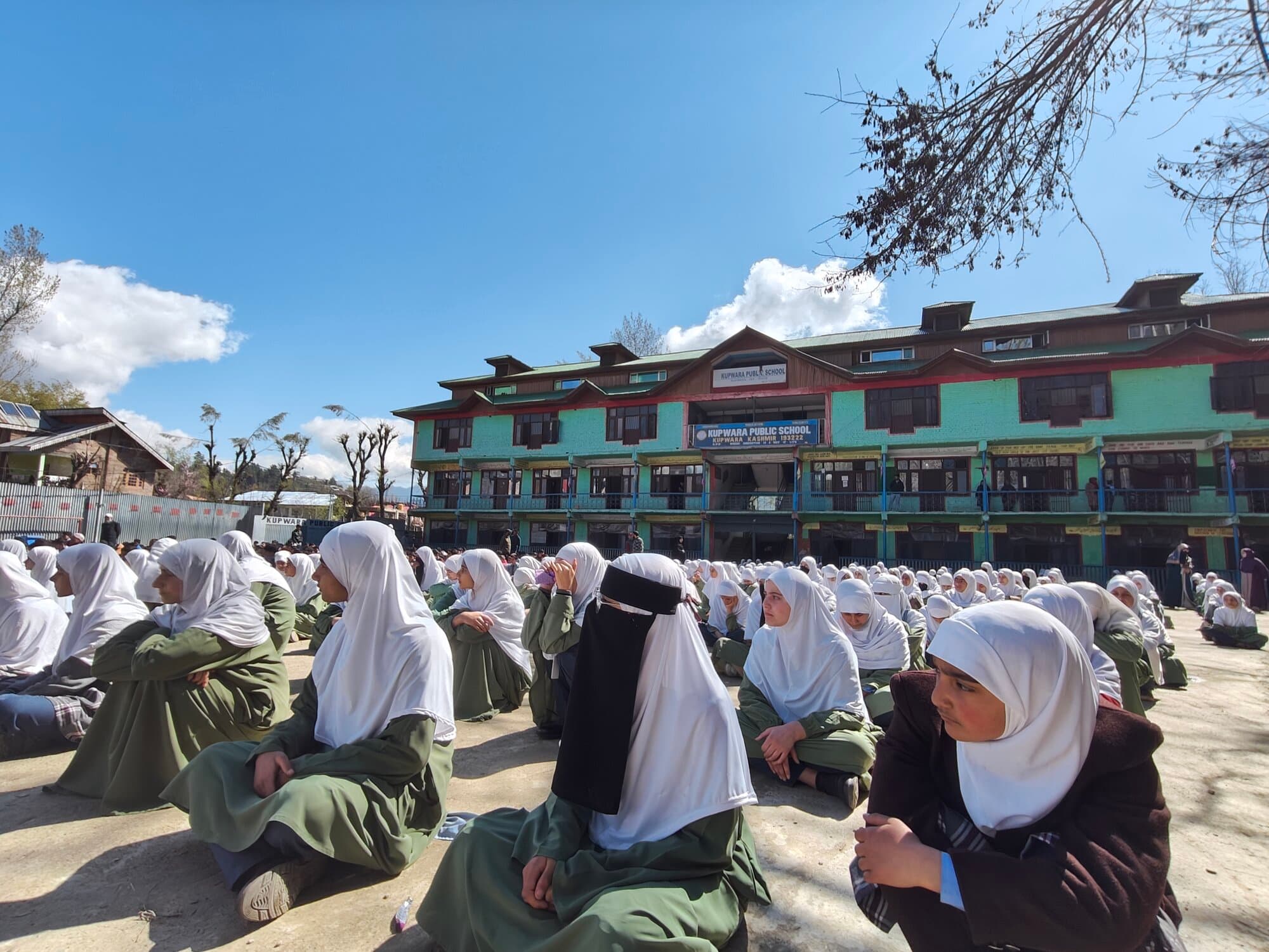 Morning assembly in front of the Kupwara Public School building